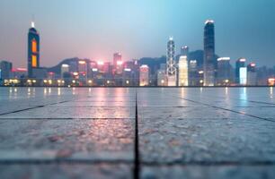 Vibrant Hong Kong Skyline at Dawn Reflected on Empty Waterfront Promenade photo