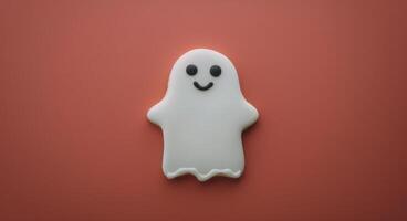 Cute Ghost-Shaped Cookie on Red Background for Halloween Celebration photo