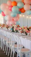 Colorful Floral Centerpieces With Balloons at Outdoor Celebration photo