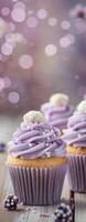Lavender Frosted Cupcakes Displayed on a Wooden Surface photo