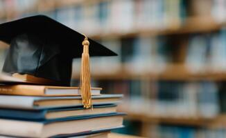 Graduation Cap on Stack of Books photo