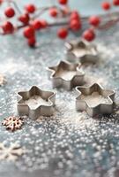 Holly Berries and Cookie Cutters on Flour photo