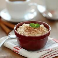 Cinnamon Rice Pudding With Mint Garnish photo