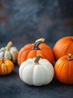 Pumpkins on a Dark Surface photo