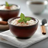Cinnamon Rice Pudding With Mint Garnish photo
