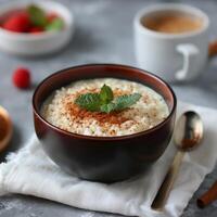 Cinnamon Rice Pudding With Mint Garnish photo