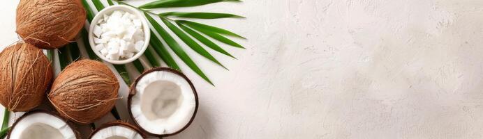 Whole and Sliced Coconuts With Palm Leaf photo