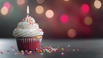 Single Birthday Cupcake With Sprinkles And Candle photo