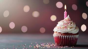 Single Birthday Cupcake With Sprinkles And Candle photo