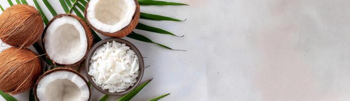 Whole and Sliced Coconuts With Palm Leaf photo