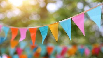 Colorful Bunting Flags Against Sunny Background photo