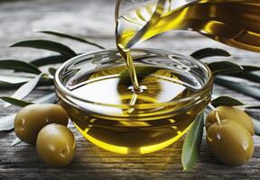 Olive Oil Pouring Into Bowl photo