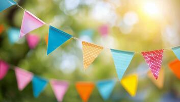 Colorful Bunting Flags Against Sunny Background photo