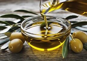 Olive Oil Pouring Into Bowl photo