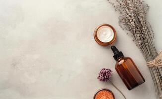 Brown Bottles And Dried Flowers On White Background photo