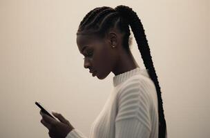 Woman Using Smartphone in Hallway photo