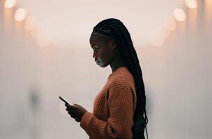 Woman Using Smartphone in Hallway photo