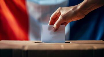 Person Voting in Ballot Box With Union Jack Flags photo