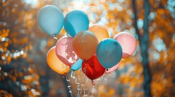 Colorful Balloons Against Autumn Foliage photo