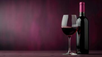 Red Wine Glass and Bottle on Table photo
