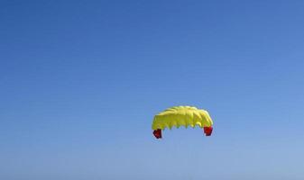 Gently sailing down with a parachute photo