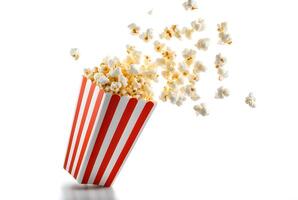 Popcorn box with popcorn floating scattered isolated on white background. Close up of products made from corn as raw material by heat cook photo