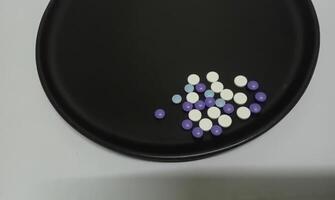 Purple and white pills photo