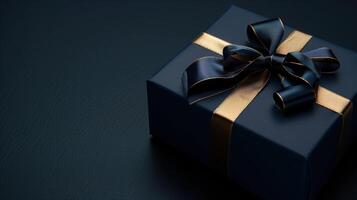 Dark blue gift box with elegant gold ribbon photo