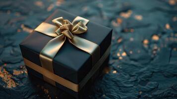 Dark vibrant gift box with elegant gold ribbon on dark background photo