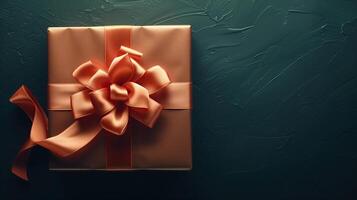 Dark peach gift box with elegant gold ribbon photo