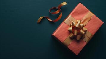Dark peach gift box with elegant gold ribbon photo