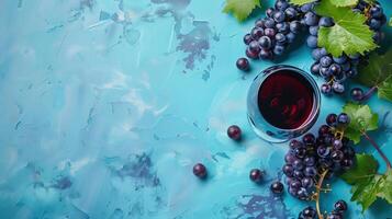 Vino tinto with purple and black grapes on a blue background photo