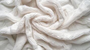 A texture of a white towel suitable for backgrounds. photo