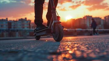 Close up of man riding black electric kick scooter photo