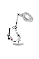 Table lamp with a magnifying glass. Magnifying glass with illumination on a white back photo