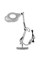 Table lamp with a magnifying glass. Magnifying glass with illumination on a white back photo