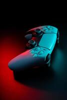 Modern white gamepad illuminated in red and blue. Game controller for games and e-sports on a dark back photo