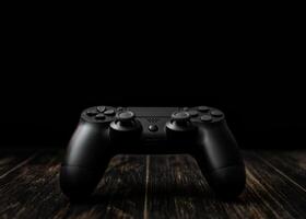 Modern black gamepad on a dark background. Game concept with copy space for text or design. photo