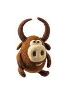 Toy bull made of felt isolate on a white background. Toy made of felted wool on a light backg. Cute soft bull figurine. Symbol of 2021. photo
