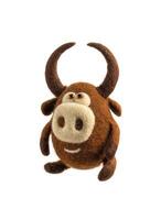 Toy bull made of felt isolate on a white background. Toy made of felted wool on a light backg. Cute soft bull figurine. Symbol of 2021. photo