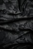 Camouflage pattern. Trendy dark gray camouflage fabric. Military texture. Dark back. photo