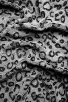 Soft fleecy faux fabric with a mottled pattern. Light leopard texture. photo