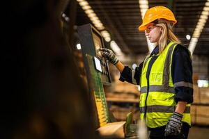 Factory engineer woman standing confident to control panel switch. Worker works at heavy machine at industry factory. worker checking timber of raw wood material. smart industry worker operating. photo