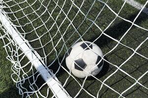 Black and white soccer and football ball in the field. Horizontal sport theme poster, greeting cards, headers, website and app photo