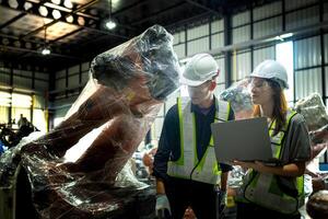team engineers inspecting on machine with smart tablet. Worker works at heavy machine robot arm. The welding machine with a remote system in an industrial factory. Artificial intelligence concept. photo