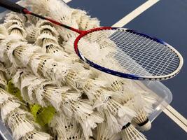 Racket and Shuttlecock with use sport or exercise on a black background. photo