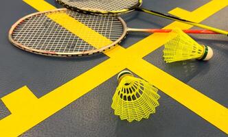 Racket and Shuttlecock with use sport or exercise on a black background. photo