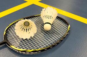 Competitive sports and high performance in tournament match conceptual idea with badminton rackets and shuttlecock with copy space photo