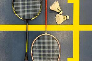 Competitive sports and high performance in tournament match conceptual idea with badminton rackets and shuttlecock with copy space photo