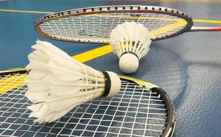 Competitive sports and high performance in tournament match conceptual idea with badminton rackets and shuttlecock with copy space photo